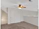 Carpeted loft featuring a ceiling fan, neutral paint, and a storage closet at 57 Craig Meadows Ln, Douglasville, GA 30134