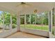 Charming screened-in porch with views of the backyard and a ceiling fan at 57 Craig Meadows Ln, Douglasville, GA 30134