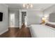 Spacious bedroom with hardwood floors, a view to the bath and walk-in closet at 111 Brighton Blvd, Woodstock, GA 30188