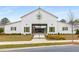The clubhouse boasts ample gathering space, a well manicured lawn, and pedestrian walkway providing convenience at 111 Brighton Blvd, Woodstock, GA 30188