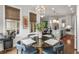 Dining area with backyard view, flowing to the kitchen with marble island at 111 Brighton Blvd, Woodstock, GA 30188