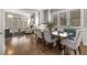 Open floor plan showing dining room with sleek table and chairs at 111 Brighton Blvd, Woodstock, GA 30188