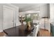 Cozy dining area with a dark wood table, seating for six, and modern lighting at 111 Brighton Blvd, Woodstock, GA 30188