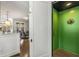 Unique elevator with green interior, hardwood floors, and a decorative sunburst at 111 Brighton Blvd, Woodstock, GA 30188