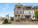 Charming townhome with brick accents, a covered front porch, and a second-story balcony at 111 Brighton Blvd, Woodstock, GA 30188