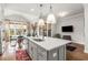 Open concept kitchen with large island, modern appliances, and a dining area at 111 Brighton Blvd, Woodstock, GA 30188