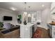 Kitchen island and eating area, and adjacent sitting room at 111 Brighton Blvd, Woodstock, GA 30188