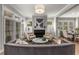 Bright and airy living room with a fireplace, plantation shutters, and an open floor plan at 111 Brighton Blvd, Woodstock, GA 30188