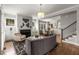 Spacious living room with fireplace, neutral decor, and an open layout to the dining area at 111 Brighton Blvd, Woodstock, GA 30188