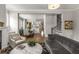 Open-concept living area leading to a dining space with hardwood floors and neutral tones at 111 Brighton Blvd, Woodstock, GA 30188