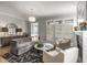 Comfortable living room featuring stylish decor, fireplace and lots of natural light at 111 Brighton Blvd, Woodstock, GA 30188