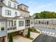 The rear of the townhome features a private porch, garage and well manicured shrubbery offering a serene and relaxing atmosphere at 111 Brighton Blvd, Woodstock, GA 30188