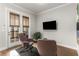 Cozy sitting room features a door to a private balcony at 111 Brighton Blvd, Woodstock, GA 30188