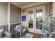 Cozy sunroom with stylish furniture, a mounted TV, and access to the outdoors at 111 Brighton Blvd, Woodstock, GA 30188