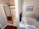 Elegant bathroom featuring a separate shower, whirlpool tub, and modern fixtures at 169 Concorde Dr, Villa Rica, GA 30180