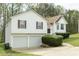 Charming two-story home with a two-car garage and well-maintained landscaping at 169 Concorde Dr, Villa Rica, GA 30180
