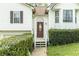 Inviting front entrance with a decorative door, trim, and manicured bushes at 169 Concorde Dr, Villa Rica, GA 30180