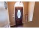 Elegant dark wood front door with decorative glass and sidelight at 169 Concorde Dr, Villa Rica, GA 30180