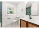 Stylish bathroom featuring a vanity with a woven design and a modern tiled shower at 2146 Trailwood Rd, Decatur, GA 30032