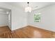 Bright, empty bedroom with wood floors, a window, and neutral paint at 2146 Trailwood Rd, Decatur, GA 30032