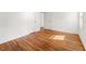 Cozy bedroom with hardwood floors, white walls, and a view to the hallway and closet at 2146 Trailwood Rd, Decatur, GA 30032