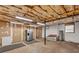 Unfinished basement with concrete floor and exposed insulation, offering potential for storage or customization at 4336 Yancey Rd, Douglasville, GA 30135