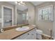 Bright bathroom featuring a granite vanity, sink, and a shower-tub combo, complete with storage at 4336 Yancey Rd, Douglasville, GA 30135