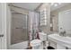 Well-lit bathroom featuring a shower-tub combo, toilet, and vanity with a sink, perfect for everyday convenience at 4336 Yancey Rd, Douglasville, GA 30135
