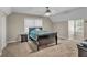 Cozy bedroom features a ceiling fan, window, and neutral carpet at 4336 Yancey Rd, Douglasville, GA 30135