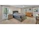 Bedroom with carpet, two large windows, ceiling fan, and furniture at 4336 Yancey Rd, Douglasville, GA 30135