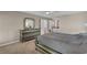 Bedroom with dresser, carpet, ceiling fan, and ensuite bathroom at 4336 Yancey Rd, Douglasville, GA 30135