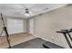 Versatile room with neutral walls, ceiling fan, and double closet doors, ideal for a bedroom or fitness area at 4336 Yancey Rd, Douglasville, GA 30135