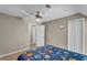 Cozy bedroom features a ceiling fan and large closet at 4336 Yancey Rd, Douglasville, GA 30135