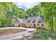 Charming home with a welcoming front porch and attached two-car garage at 4336 Yancey Rd, Douglasville, GA 30135