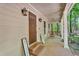 Inviting front porch with seating area and a warm, welcoming entrance at 4336 Yancey Rd, Douglasville, GA 30135