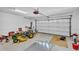Spacious garage with an open overhead door and ample space for vehicles and equipment at 4336 Yancey Rd, Douglasville, GA 30135