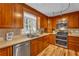 Kitchen showcasing wood cabinets, stainless steel appliances, and ample counter space at 4336 Yancey Rd, Douglasville, GA 30135