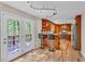 Kitchen featuring wood cabinets, stainless steel appliances, and adjacent access to the outdoor deck at 4336 Yancey Rd, Douglasville, GA 30135