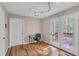 Office space with hardwood floors, natural light, desk, and access to the deck through glass doors at 4336 Yancey Rd, Douglasville, GA 30135