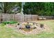 A serene backyard showcases a rock water feature and lush landscaping, creating a peaceful retreat at 5241 Marston Rd, Atlanta, GA 30360