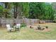 Lush backyard featuring a tranquil water feature, well-maintained lawn, and a serene outdoor seating area at 5241 Marston Rd, Atlanta, GA 30360