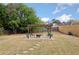 A backyard with a charming pergola, fire pit, and seating area provides a cozy outdoor space at 5241 Marston Rd, Atlanta, GA 30360