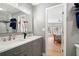 Bathroom boasts double sinks, and a view to bedroom with a tiled shower in the background at 5241 Marston Rd, Atlanta, GA 30360