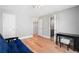 Open doorway view of second-floor hall and an attached bathroom with hardwood floors at 5241 Marston Rd, Atlanta, GA 30360