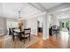 Elegant dining room with a chandelier, a large window, and easy access to the open-concept kitchen at 5241 Marston Rd, Atlanta, GA 30360