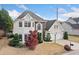 Attractive two-story home features a manicured lawn, stone accents, and a two-car garage at 5241 Marston Rd, Atlanta, GA 30360