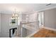 Bright foyer with hardwood floors, a chandelier, and a view of the front door at 5241 Marston Rd, Atlanta, GA 30360