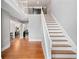 Grand foyer with hardwood floors, a staircase, and an open view into the home's interior at 5241 Marston Rd, Atlanta, GA 30360