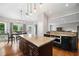 Eat-in kitchen featuring kitchen island, stainless steel appliances, and hardwood floors at 5241 Marston Rd, Atlanta, GA 30360