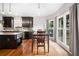 Eat-in kitchen showcasing island, stainless steel appliances, and large windows at 5241 Marston Rd, Atlanta, GA 30360